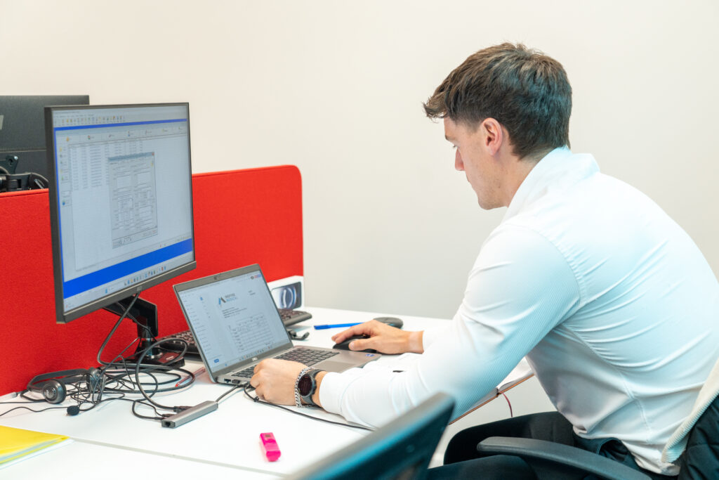 An Inspire Medical recruiter working at a two-screen desk