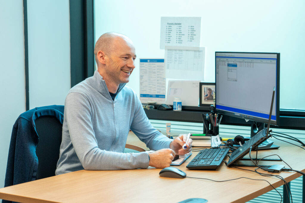 An Inspire Medical consultant making notes while working through a doctor placement